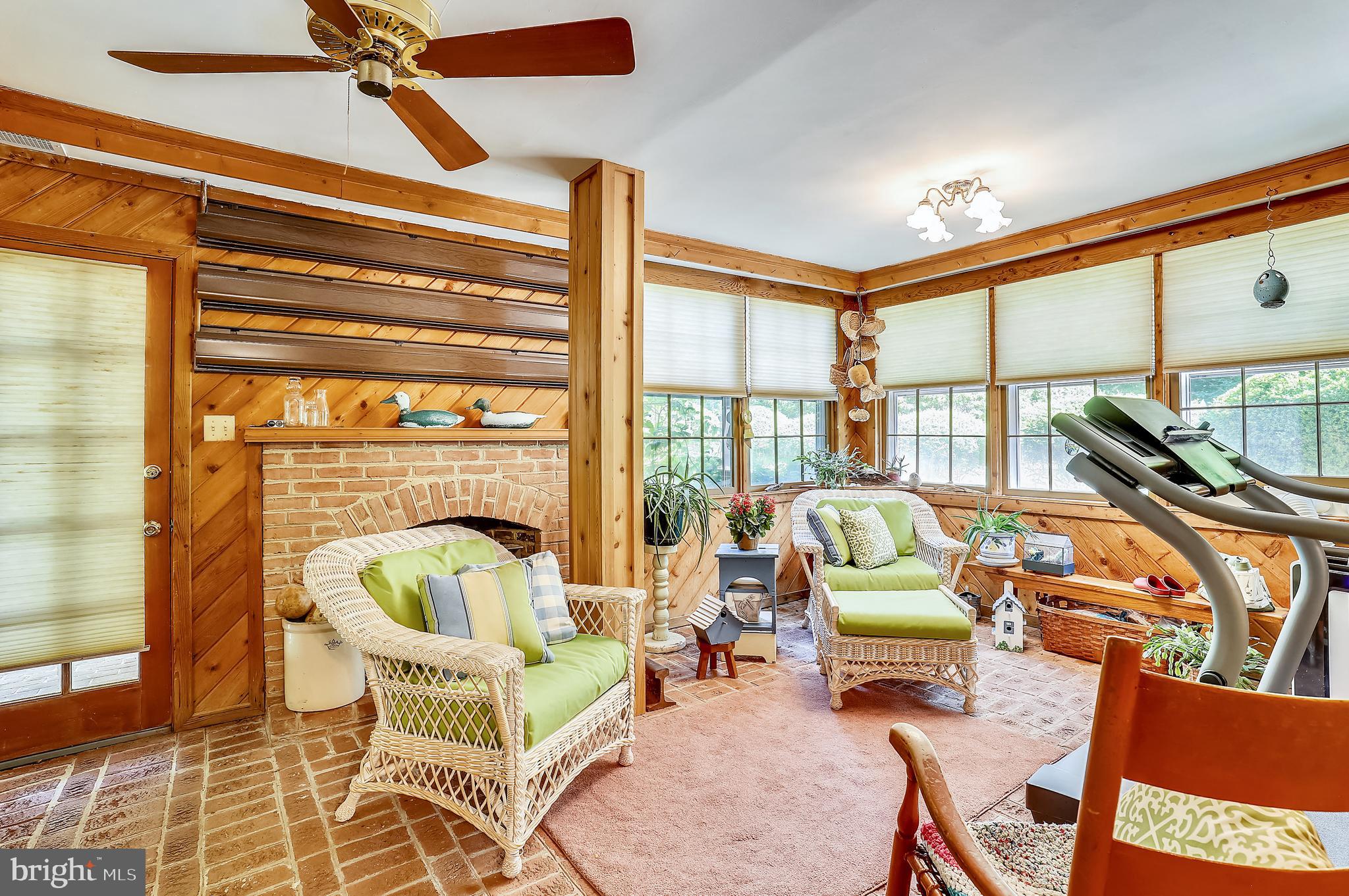 1895 German Chapel Road Prince Frederick, MD 20678 - Photo 44 of 90 Sunroom with fireplace, brick floor, cedar walls