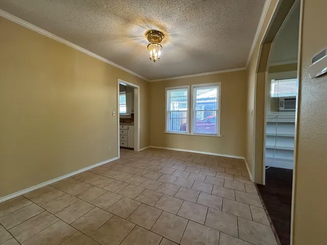 a kitchen with sink a refrigerator and cabinets