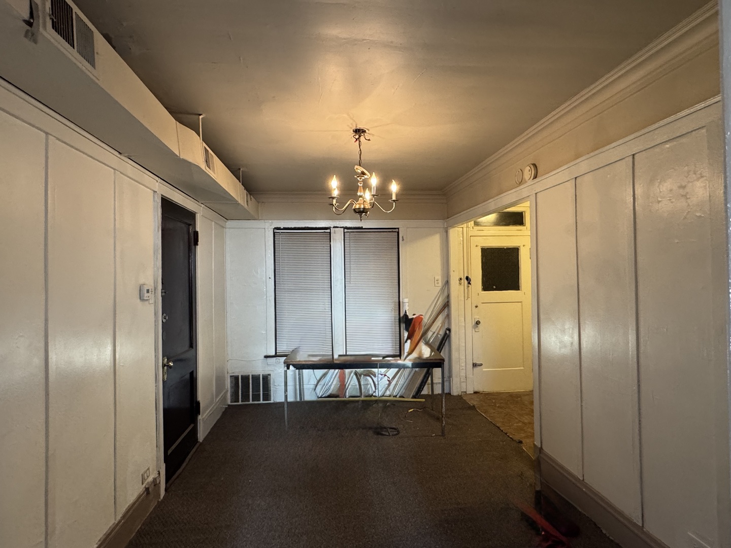 7329 South Coles Avenue Chicago, IL 60649 - Photo 17 of 20 a view of a hallway with wooden shelves