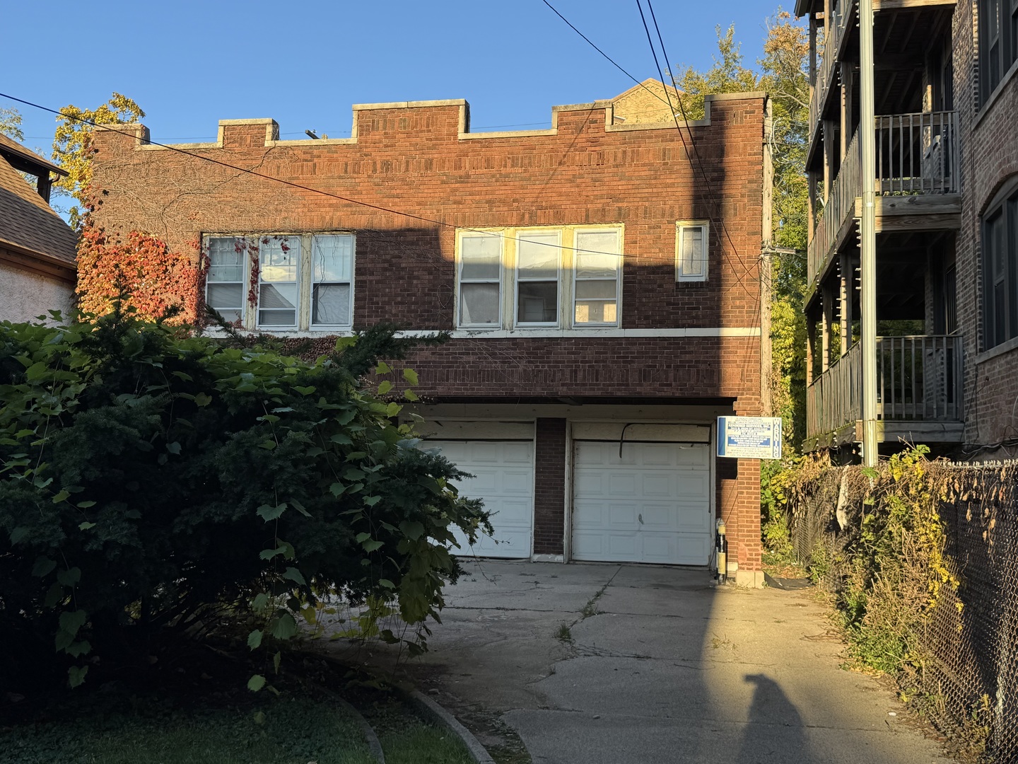 7329 South Coles Avenue Chicago, IL 60649 - Photo 20 of 20 a front view of a house with a yard