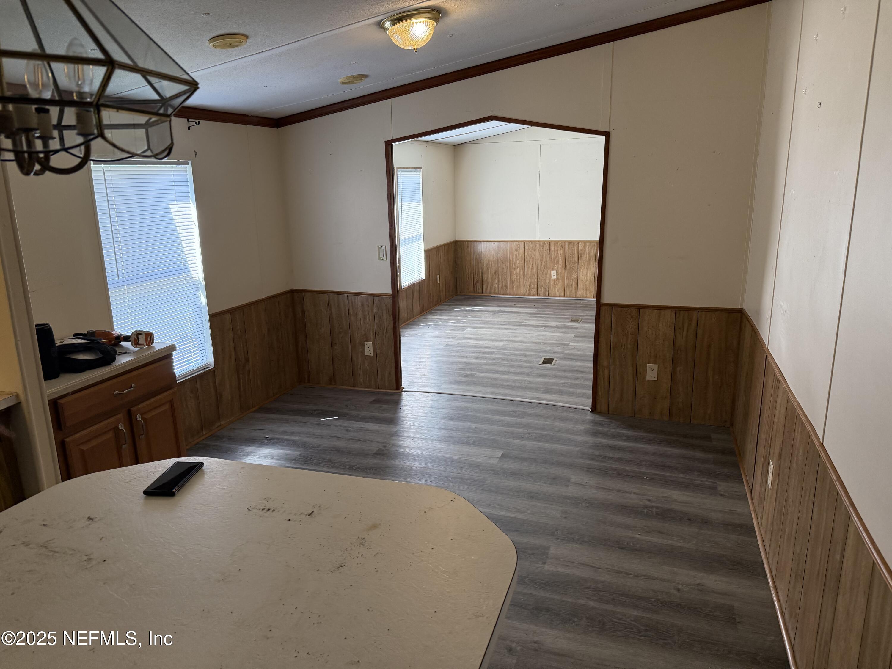 3255 County Road 208 St. Augustine, FL 32092 - Photo 11 of 22 a living room with wooden floor