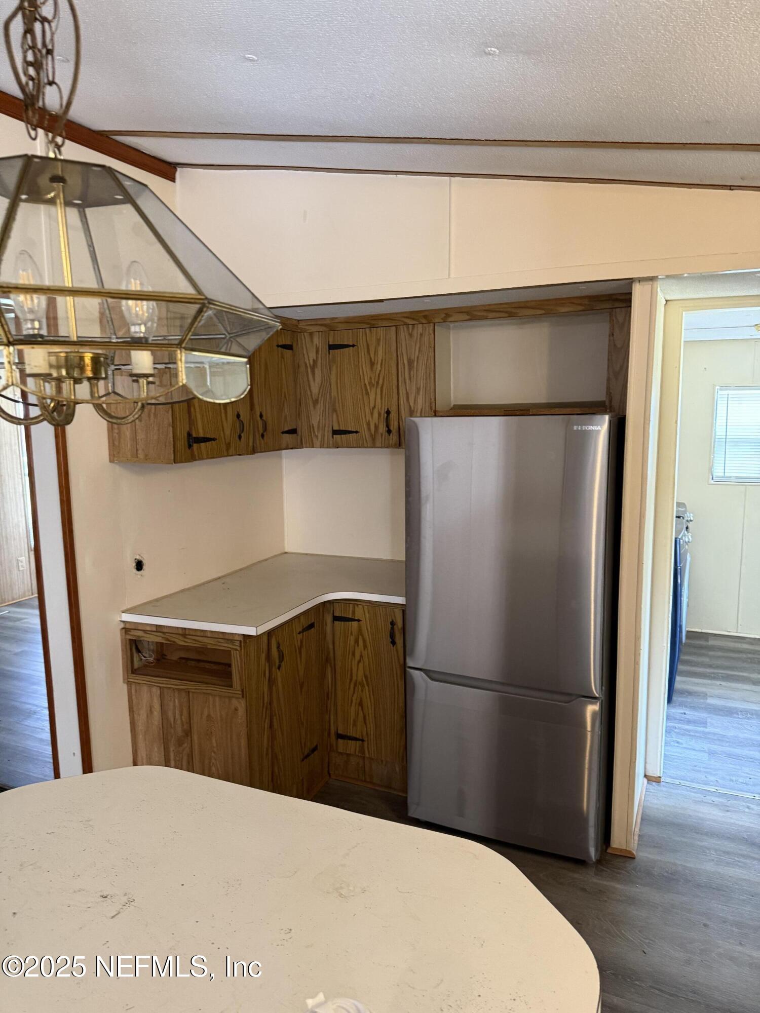 3255 County Road 208 St. Augustine, FL 32092 - Photo 13 of 22 a kitchen with stainless steel appliances a refrigerator and a microwave