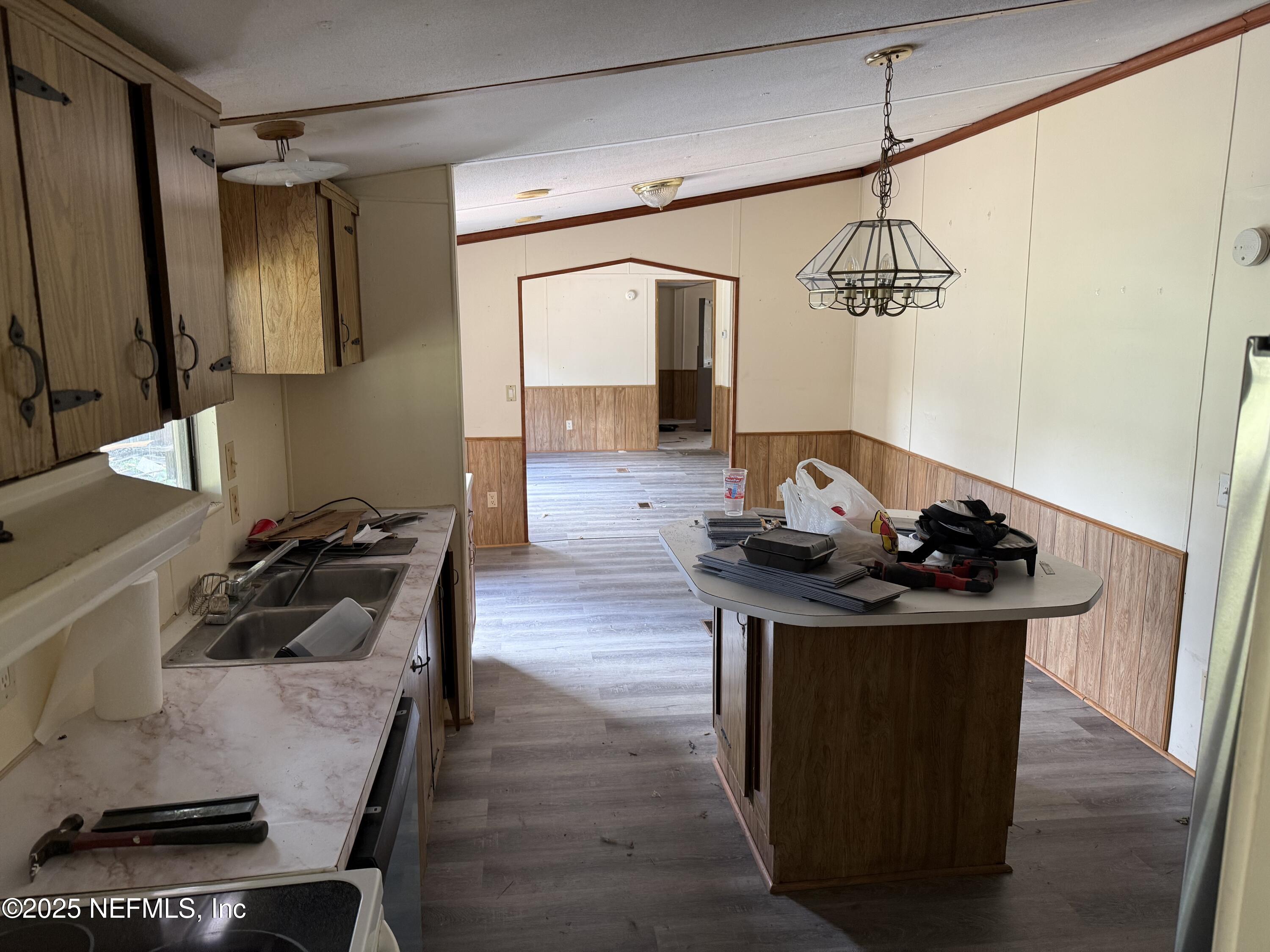 3255 County Road 208 St. Augustine, FL 32092 - Photo 14 of 22 a living room with furniture and a flat screen tv