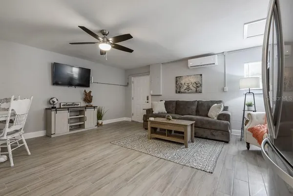 a living room with furniture and a flat screen tv