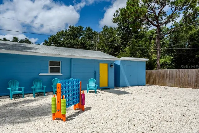 a view of a backyard of the house