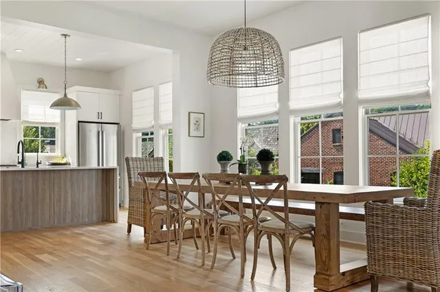 a view of a dining room with furniture window and wooden floor