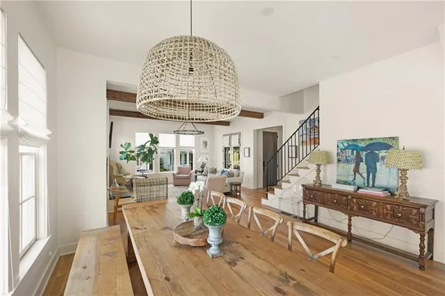 a view of a dining room with furniture wooden floor and chandelier