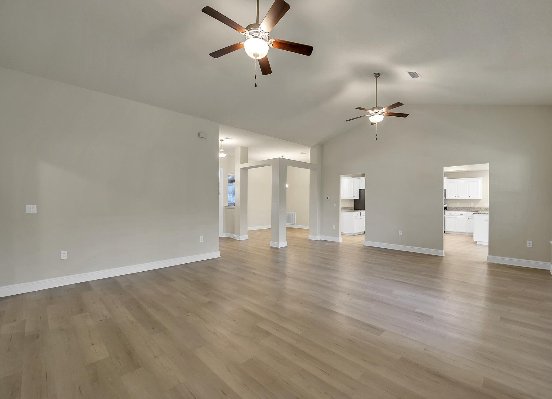 3639 Ranch Drive Crestview, FL 32539 - Photo 42 of 84 wooden floor in an empty room with a window