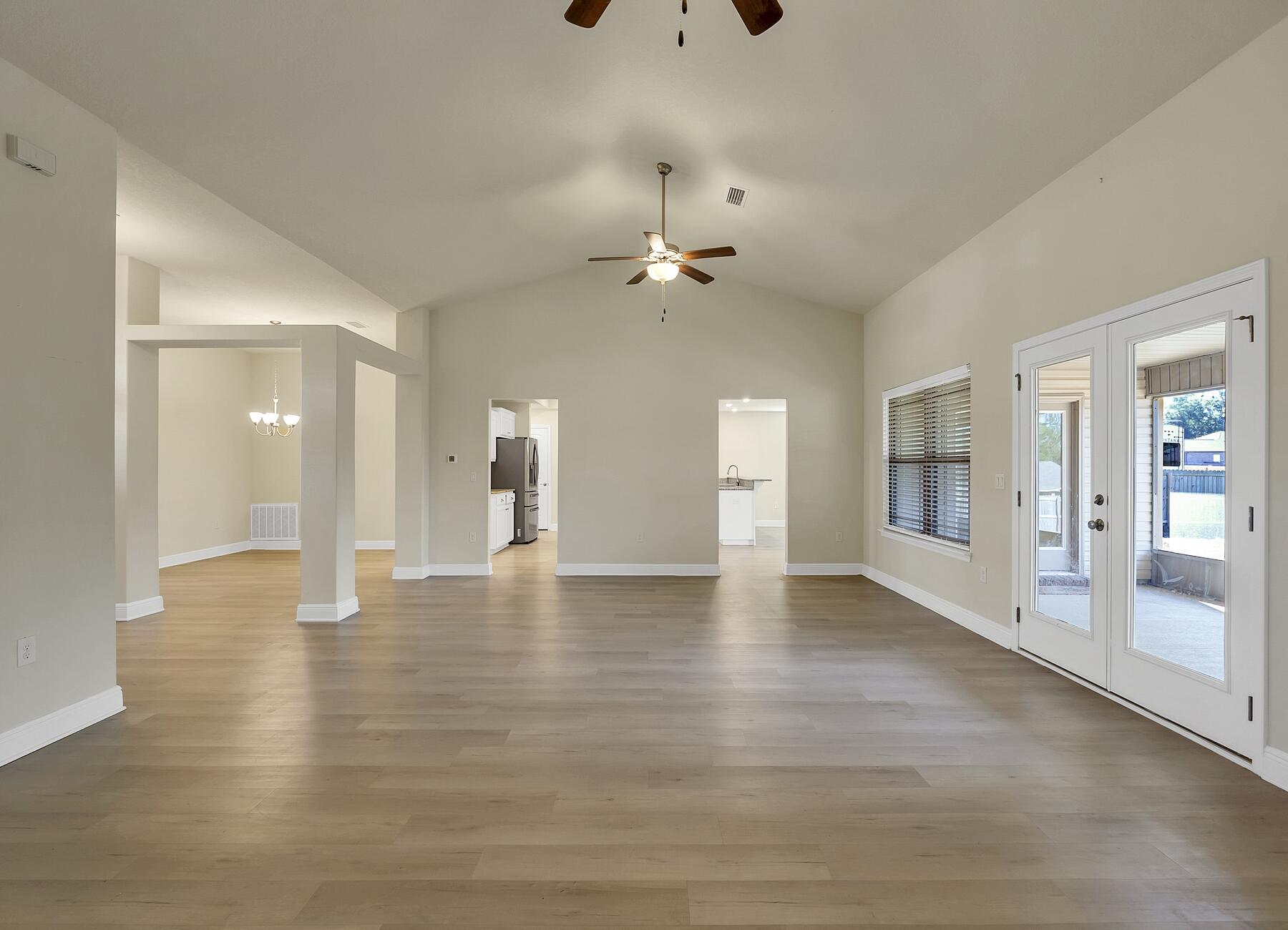 3639 Ranch Drive Crestview, FL 32539 - Photo 43 of 84 a view of an empty room with window and wooden floor