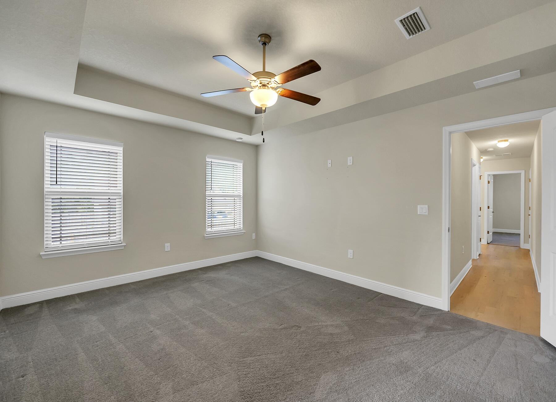 3639 Ranch Drive Crestview, FL 32539 - Photo 50 of 84 a view of an empty room with window and chandelier fan