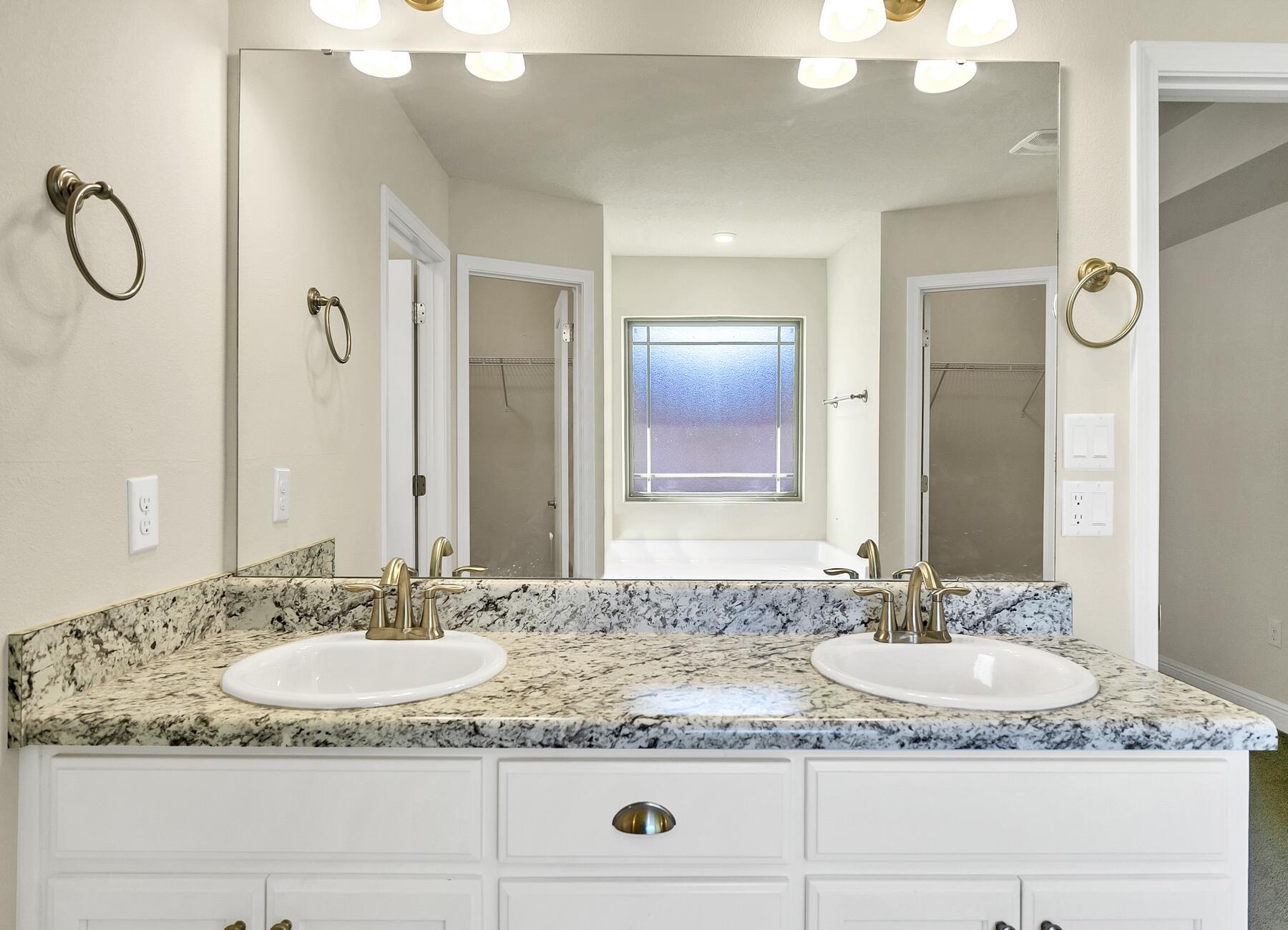 3639 Ranch Drive Crestview, FL 32539 - Photo 73 of 84 a bathroom with a granite countertop sink and a mirror