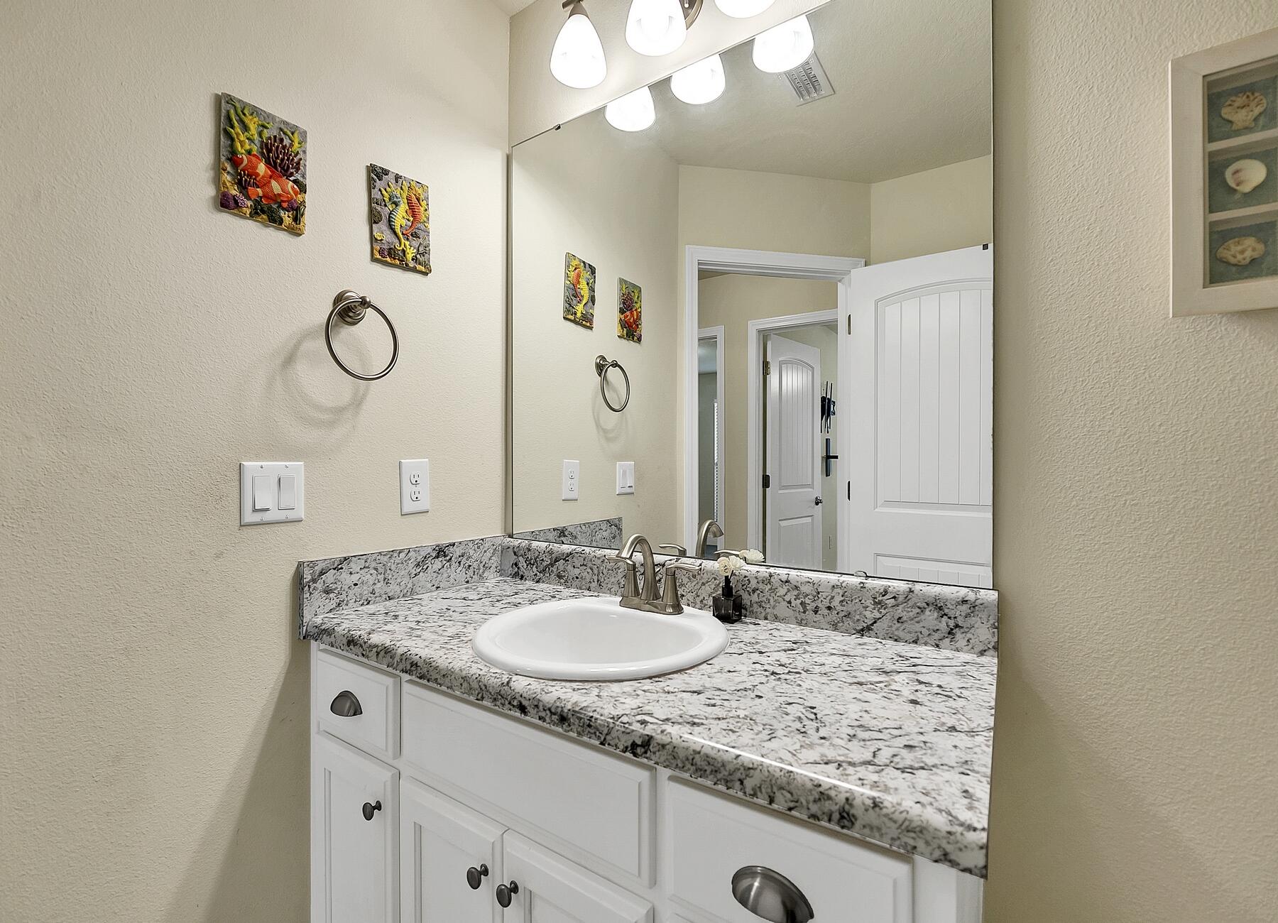 3639 Ranch Drive Crestview, FL 32539 - Photo 81 of 84 a bathroom with a granite countertop sink and a mirror