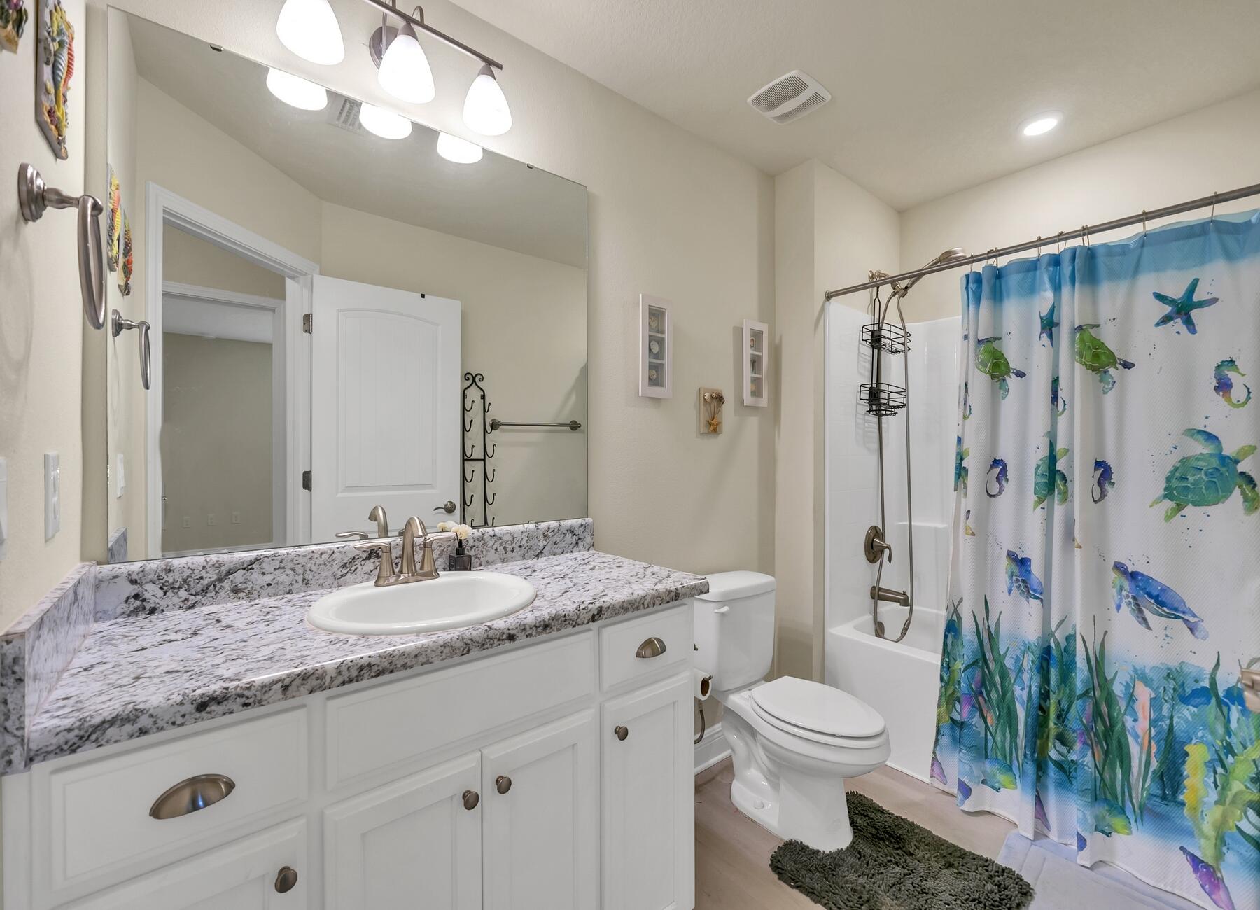 3639 Ranch Drive Crestview, FL 32539 - Photo 82 of 84 a bathroom with a granite countertop sink toilet a large mirror a shower and a mirror
