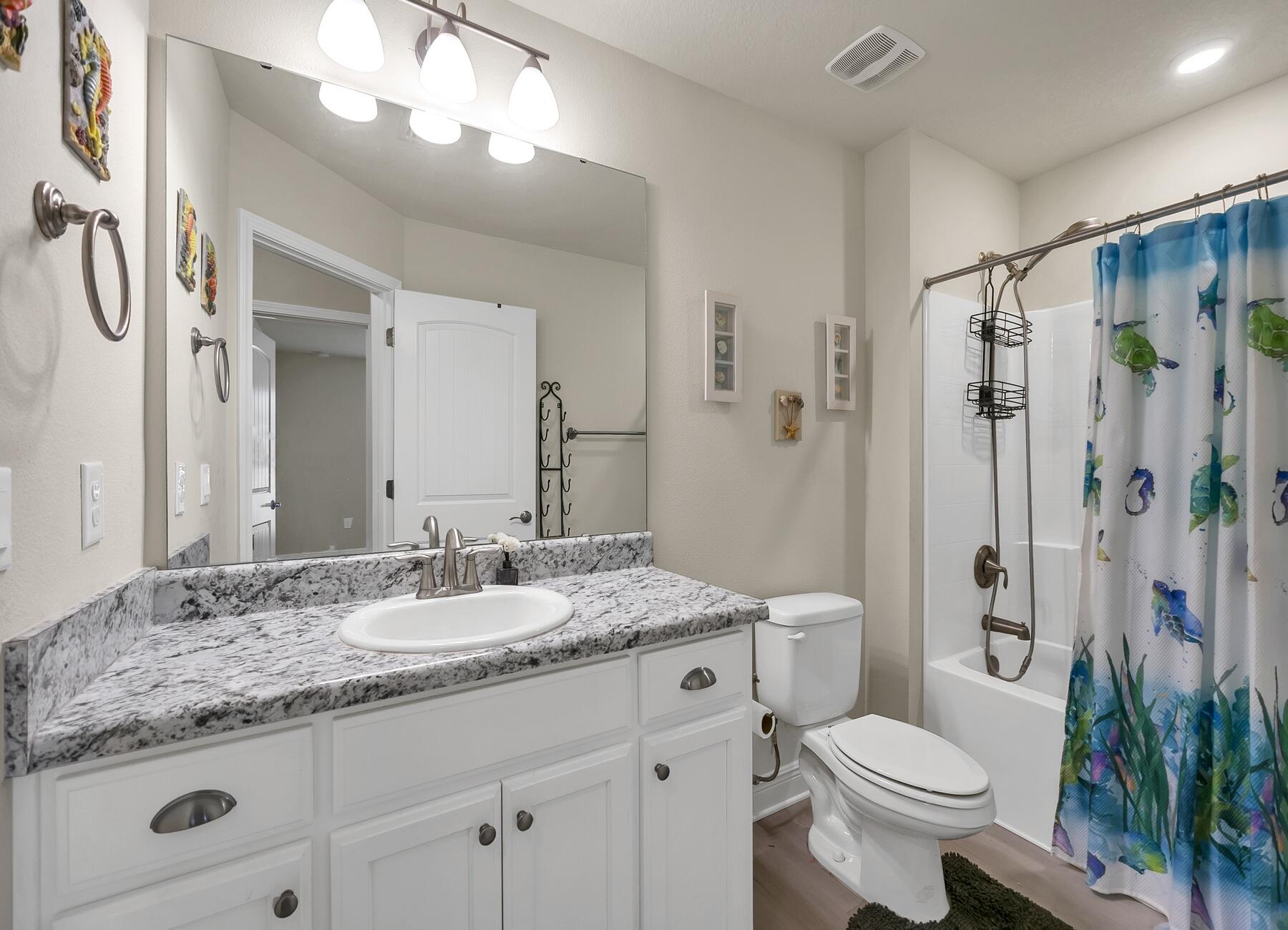 3639 Ranch Drive Crestview, FL 32539 - Photo 83 of 84 a bathroom with a granite countertop sink toilet and shower
