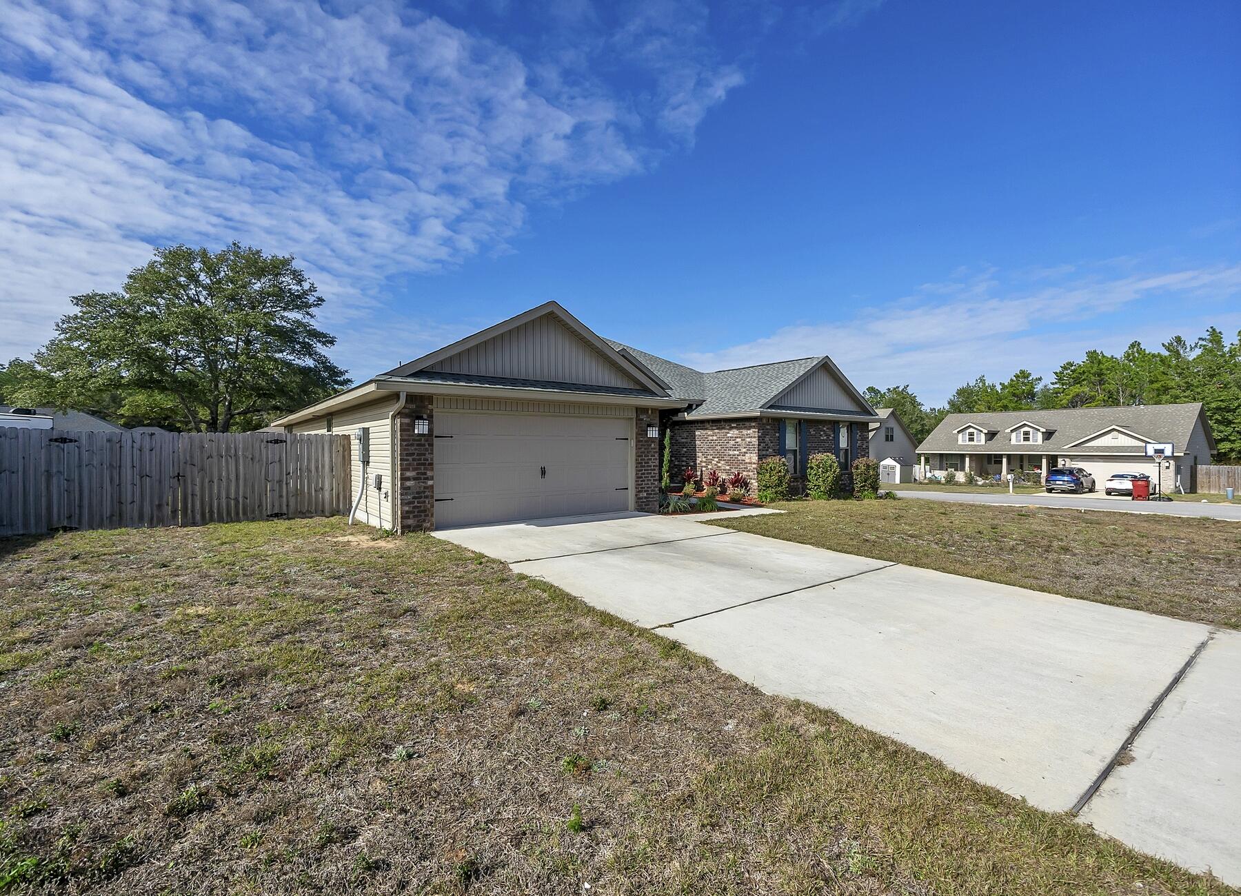 3639 Ranch Drive Crestview, FL 32539 - Photo 9 of 84 a house with yard in front of it