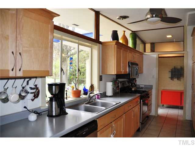 722 Graham Street Raleigh, NC 27605 - Photo 6 of 24 The huge window over the sink plus the clerestory windows make this stunning kitchen stand out as a focal point in the home. Kitchen