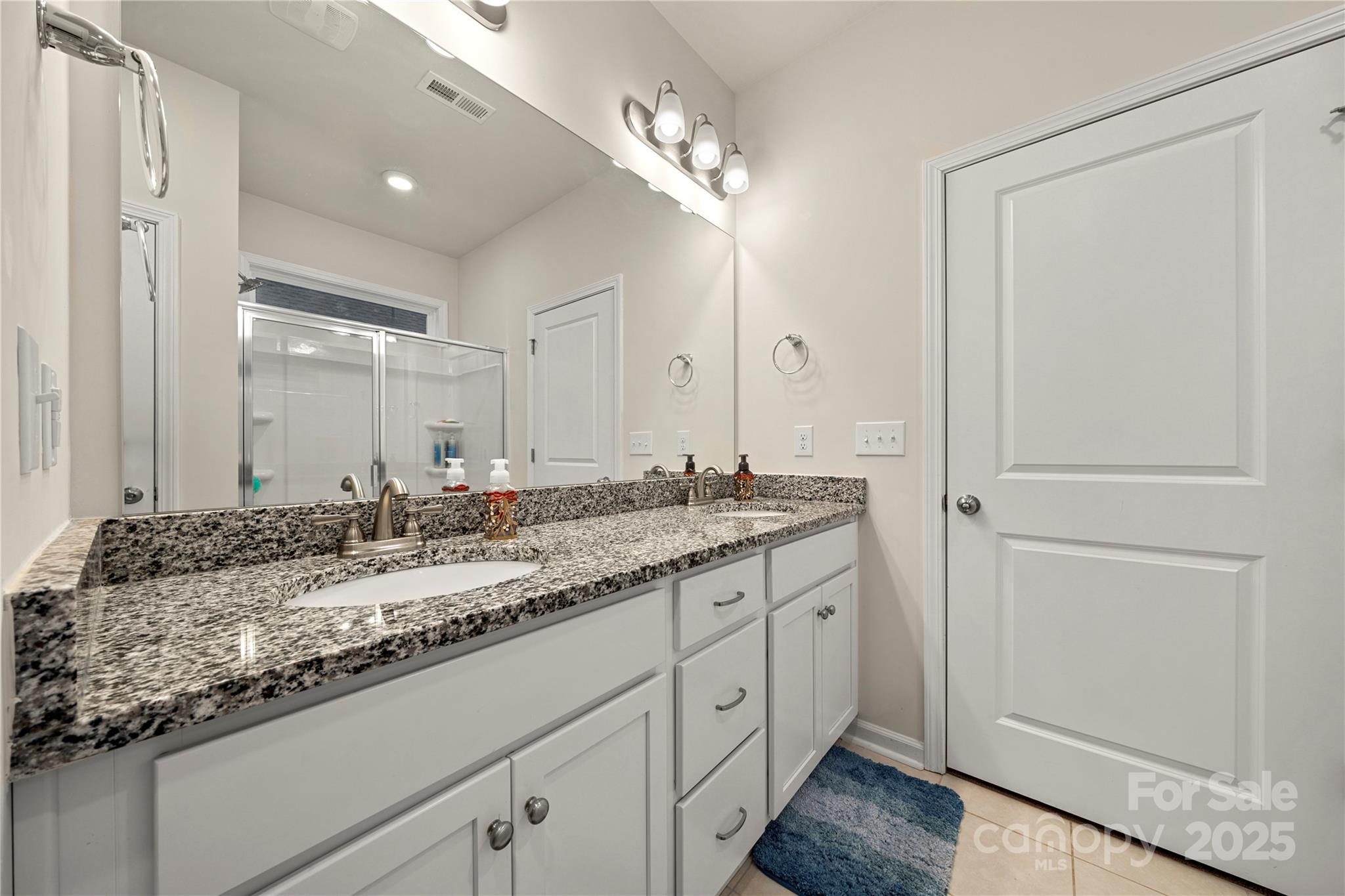1990 Ambrose Way Denver, NC 28037 - Photo 20 of 40 a bathroom with a granite countertop sink and a mirror