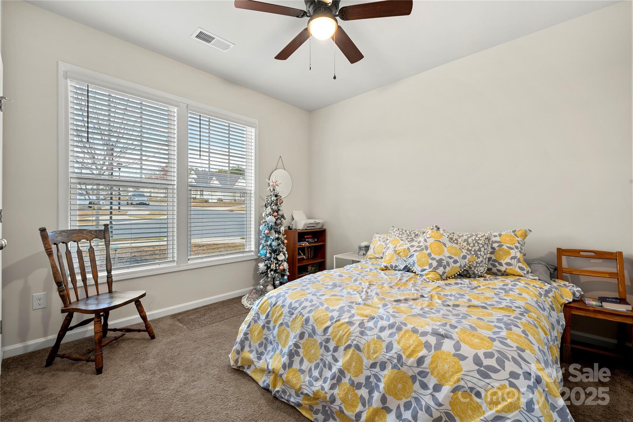 1990 Ambrose Way Denver, NC 28037 - Photo 21 of 40 a bedroom with a bed and a chandelier
