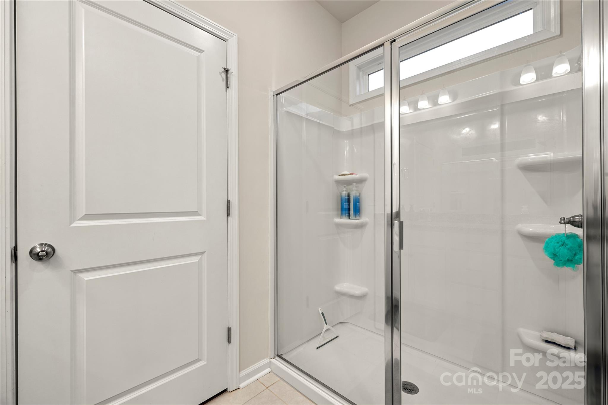 1990 Ambrose Way Denver, NC 28037 - Photo 24 of 40 a bathroom with a glass shower door