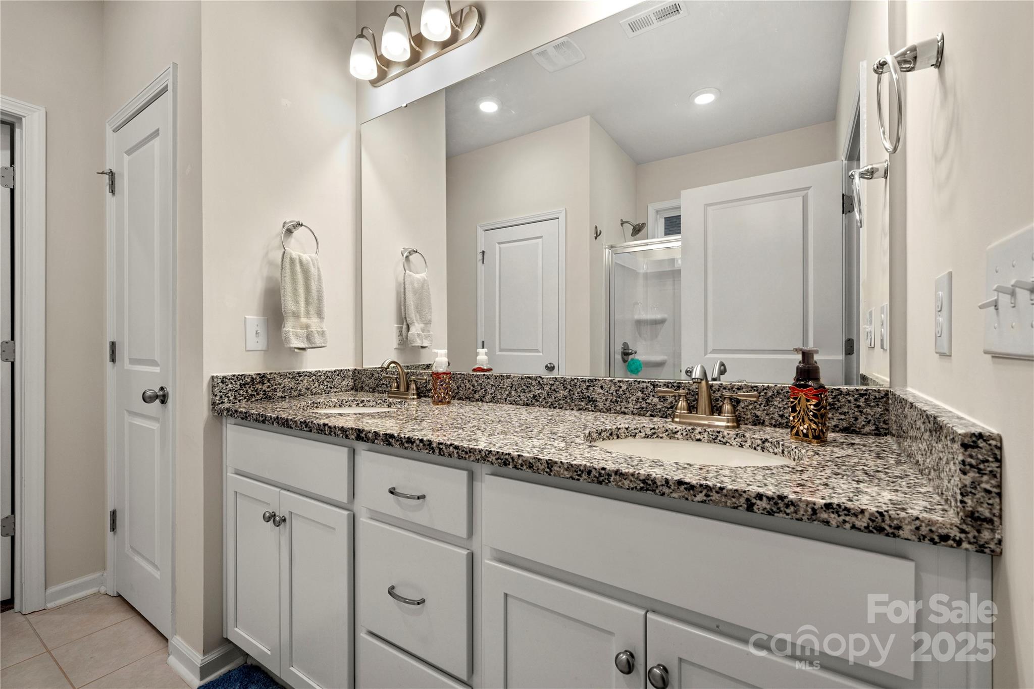 1990 Ambrose Way Denver, NC 28037 - Photo 25 of 40 a bathroom with a granite countertop double vanity sink and a mirror