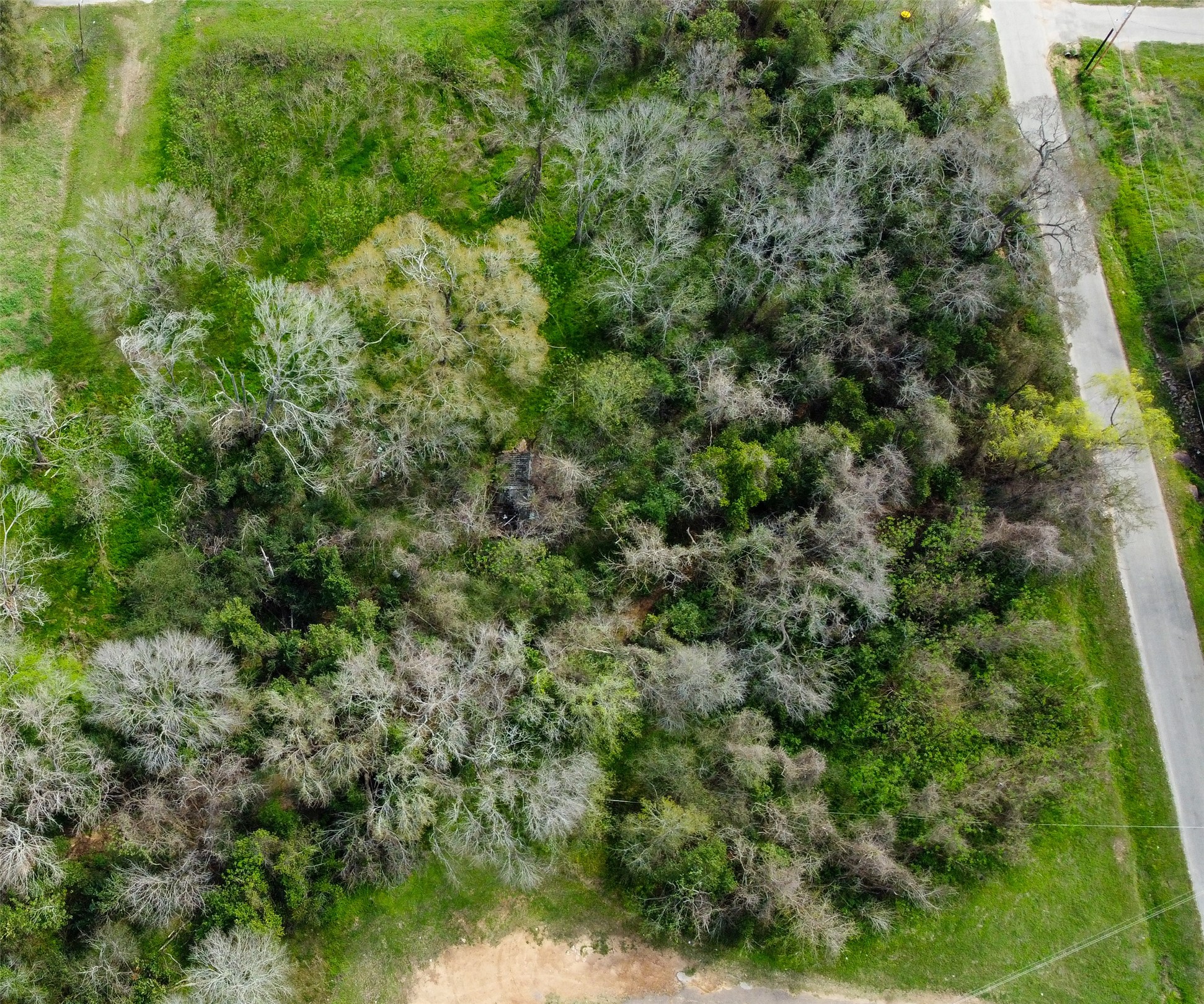 0 17th Street Hempstead, TX 77445 - Photo 3 of 6 an aerial view of residential houses with outdoor space and trees