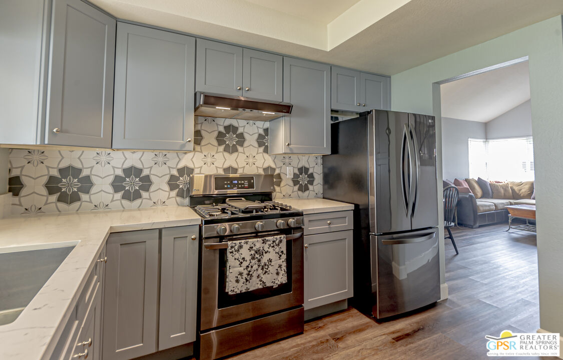 2853 Bragg Street Riverside, CA 92503 - Photo 8 of 43 a kitchen with appliances and a refrigerator