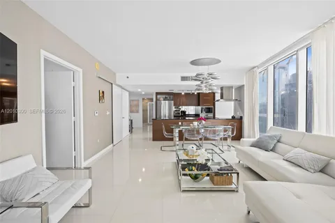 a kitchen with stainless steel appliances kitchen island granite countertop a sink and cabinets