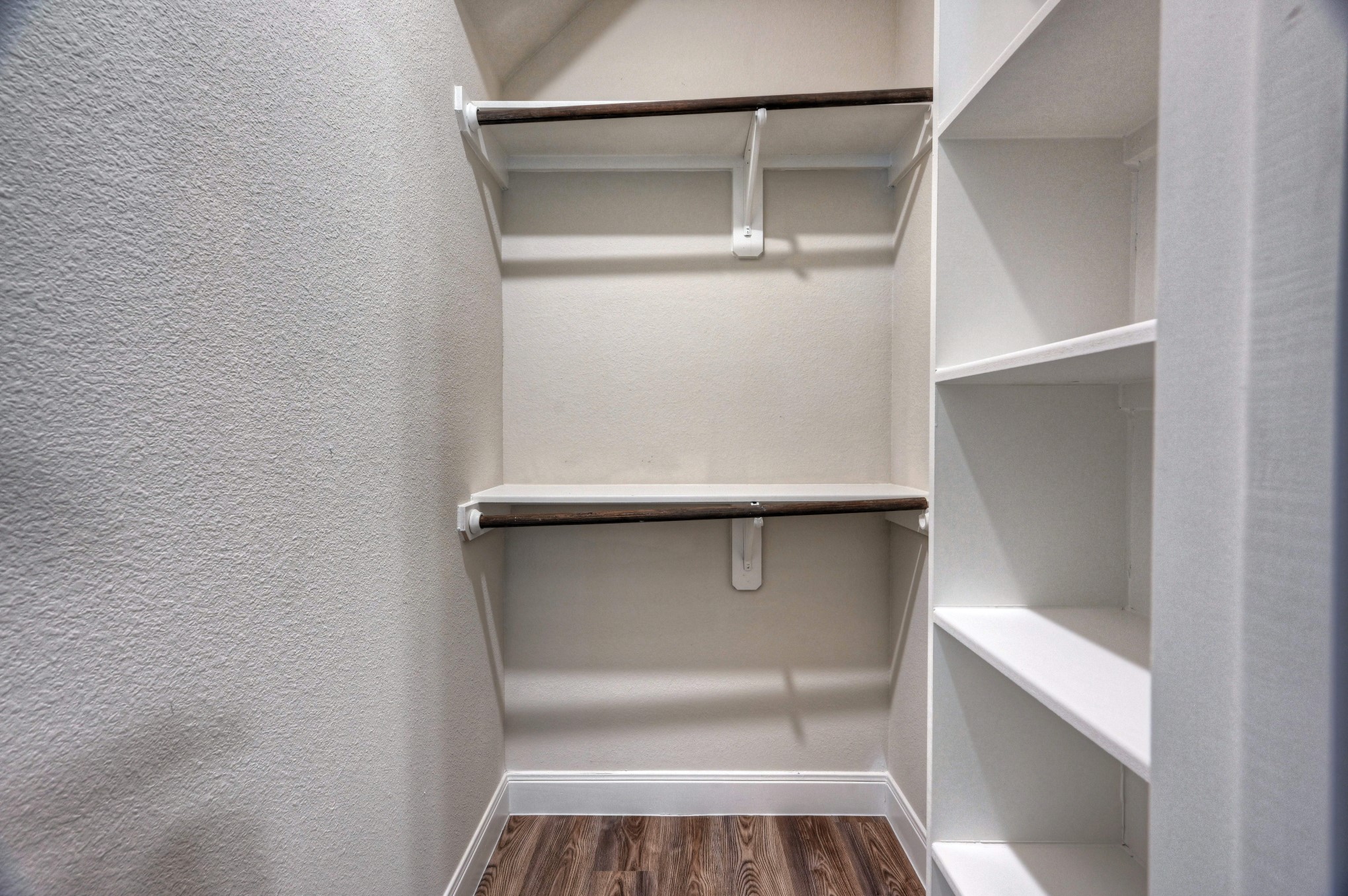 9173 Inwood Willis, TX 77318 - Photo 18 of 31 a view of walk in closet with empty racks