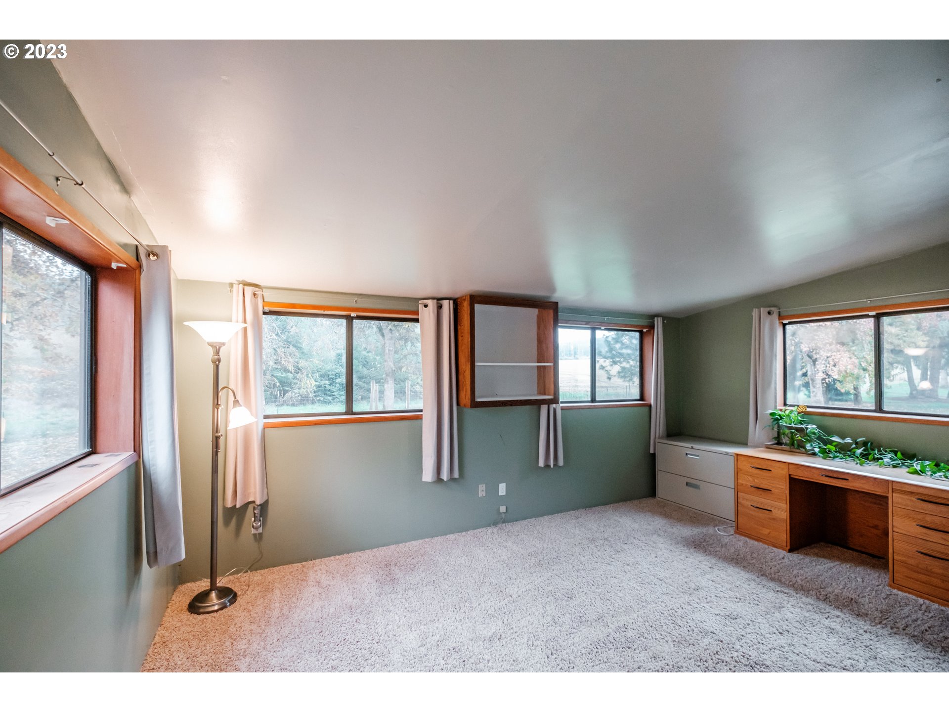 30115 Berlin Road Lebanon, OR 97355 - Photo 17 of 48 a living room with furniture and a large window