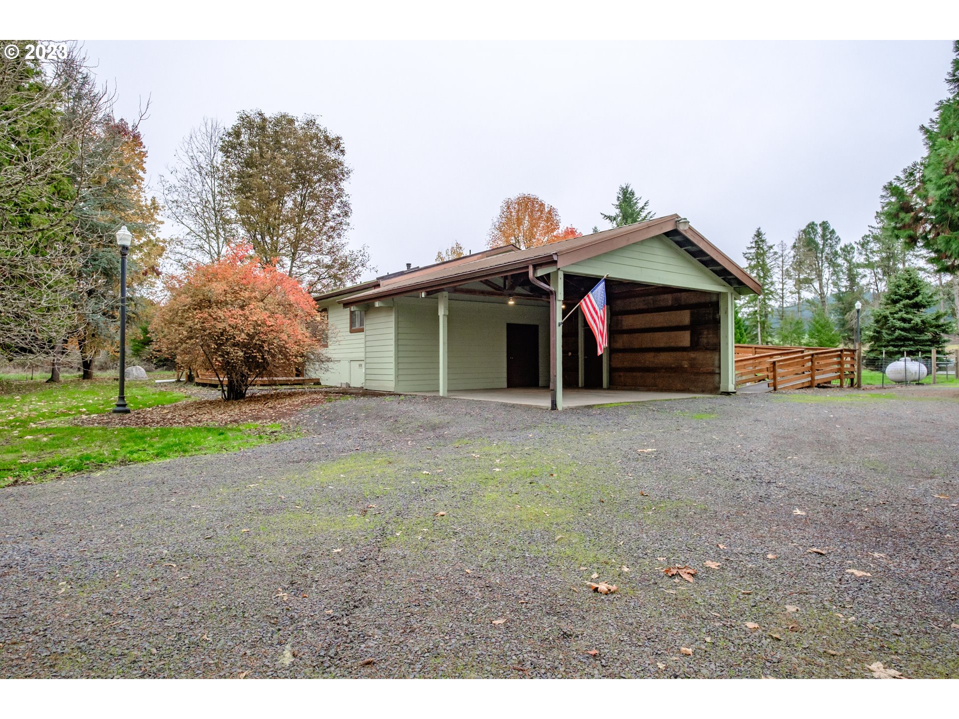 30115 Berlin Road Lebanon, OR 97355 - Photo 29 of 48 a view of a house with a yard and garage