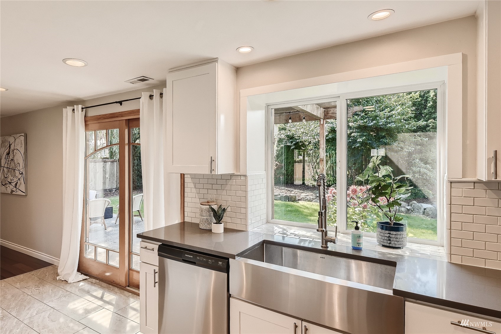 314 213th Place Southwest Bothell, WA 98021 - Photo 11 of 29 a kitchen with a sink and large window