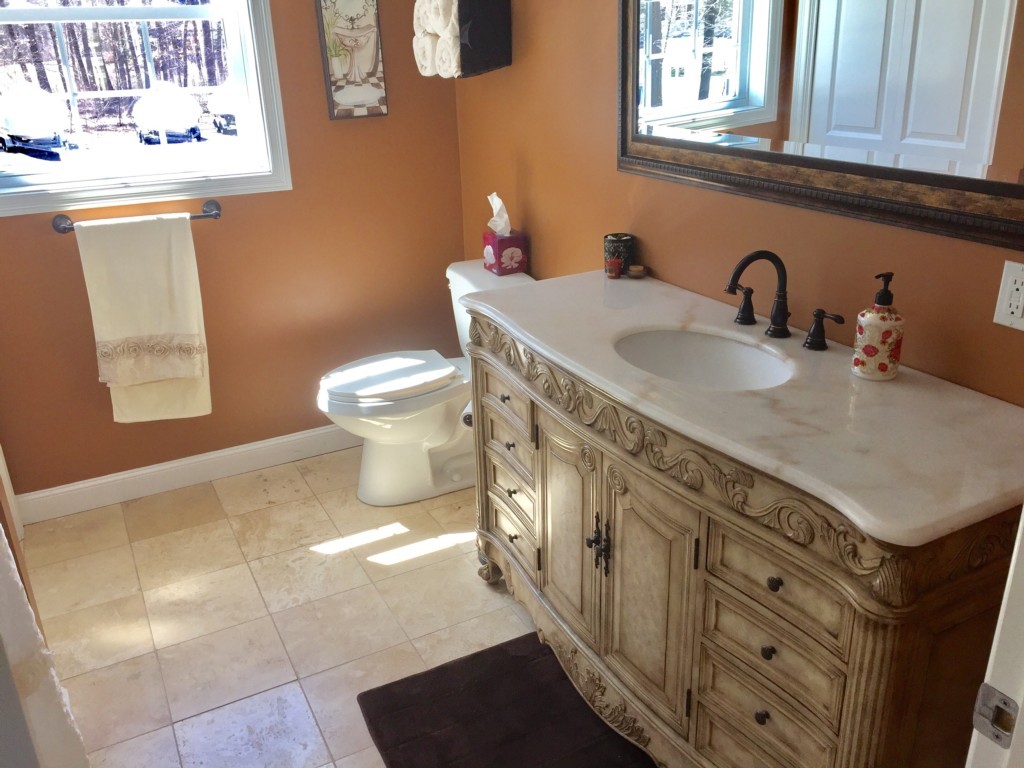 19 Baker Road Salisbury, MA 01952 - Photo 11 of 12 a bathroom with a sink toilet and mirror