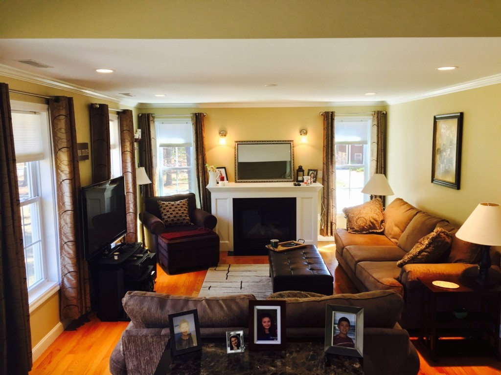 19 Baker Road Salisbury, MA 01952 - Photo 2 of 12 a living room with furniture and a fireplace
