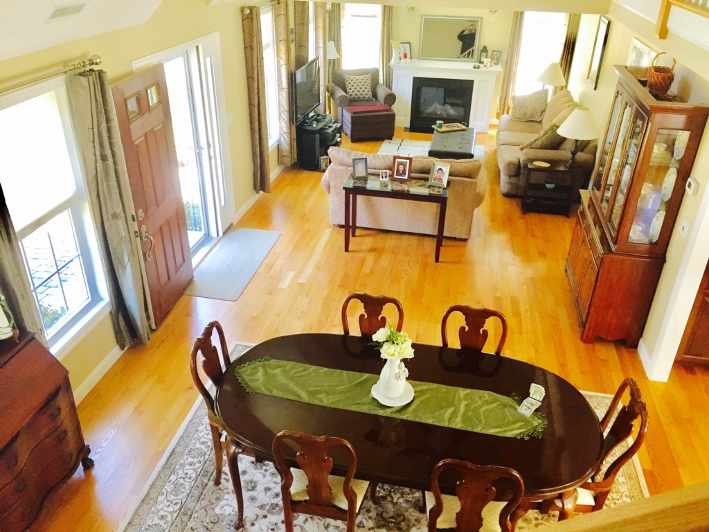 19 Baker Road Salisbury, MA 01952 - Photo 4 of 12 a view of a dining room with furniture a fireplace and wooden floor