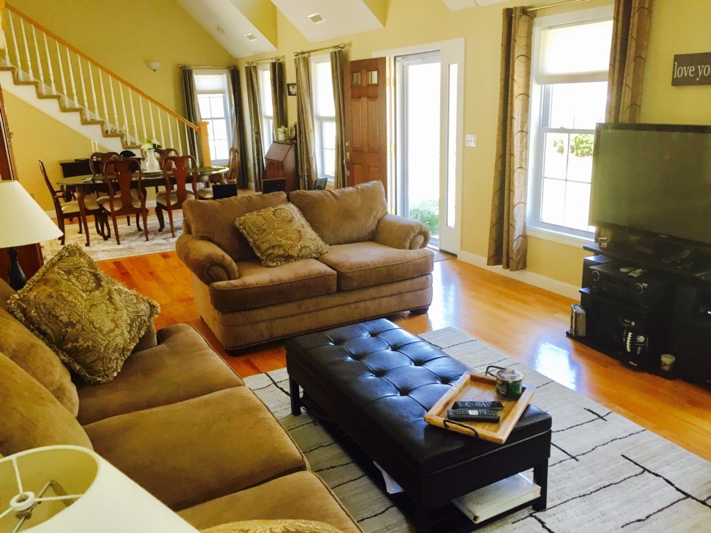 19 Baker Road Salisbury, MA 01952 - Photo 5 of 12 a living room with furniture fireplace and a window