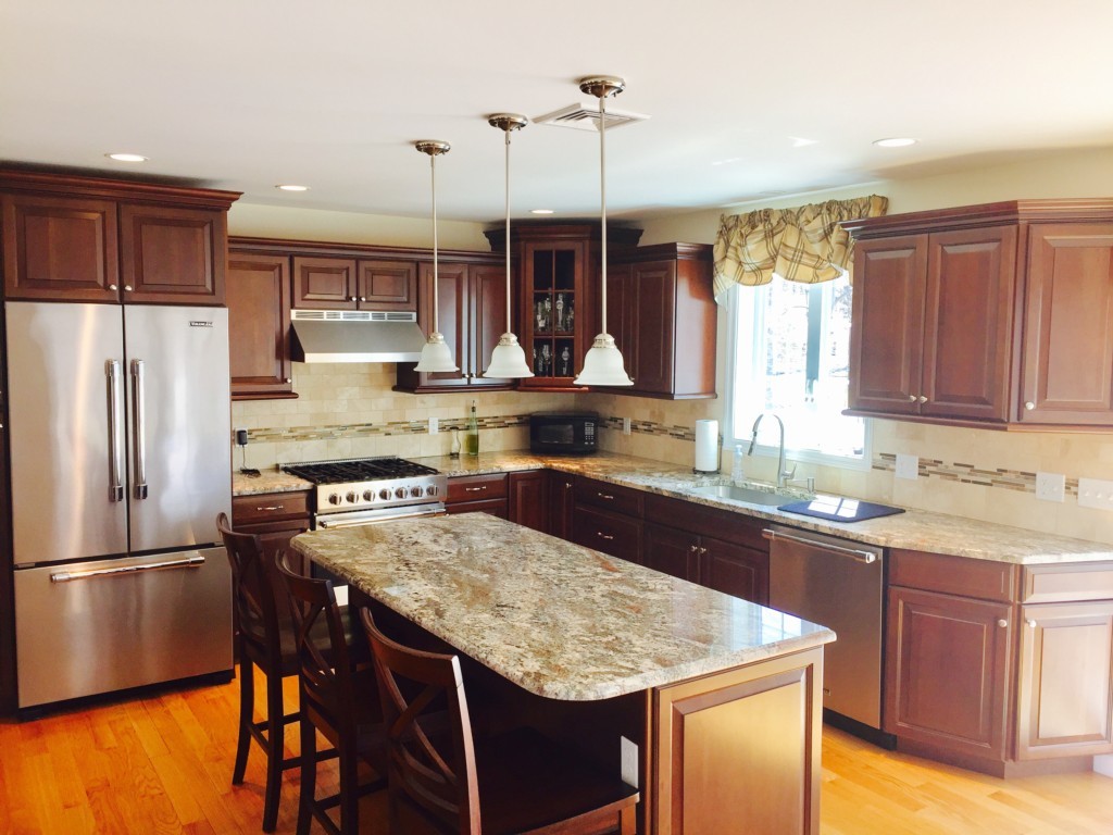 19 Baker Road Salisbury, MA 01952 - Photo 6 of 12 a kitchen with stainless steel appliances granite countertop a sink a stove and refrigerator
