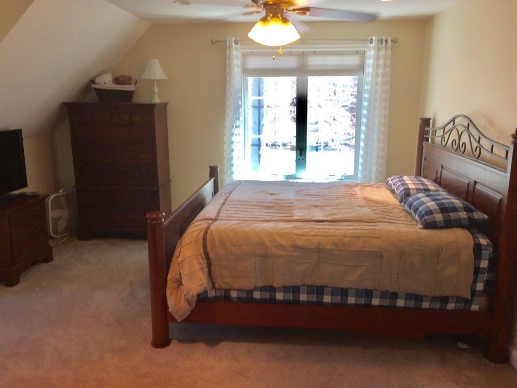 19 Baker Road Salisbury, MA 01952 - Photo 8 of 12 a bedroom with a bed and a window