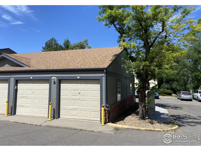 a view of a house with a tree