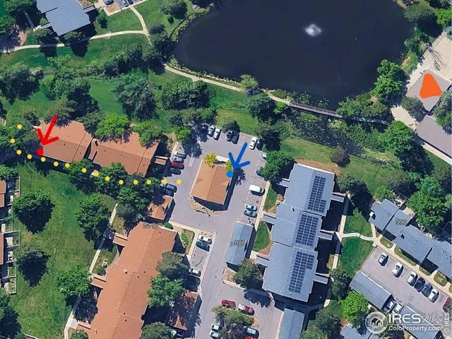 an aerial view of residential house with outdoor space and street view