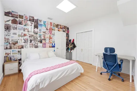 a bedroom with a bed and a bookshelf