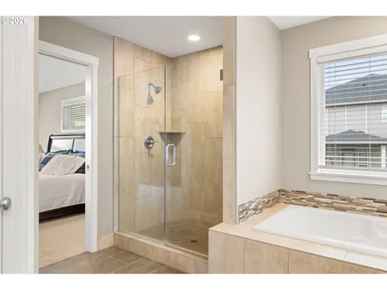 a bathroom with a tub sink and a shower