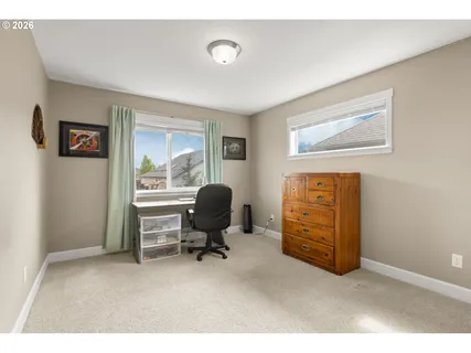 a workspace with furniture and a window