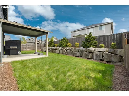 a view of a backyard with furniture
