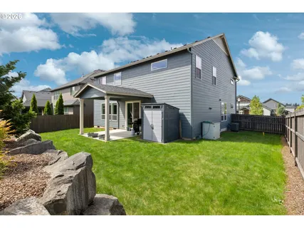 a view of a house with backyard porch and garden