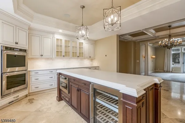 a kitchen that has a lot of cabinets in it