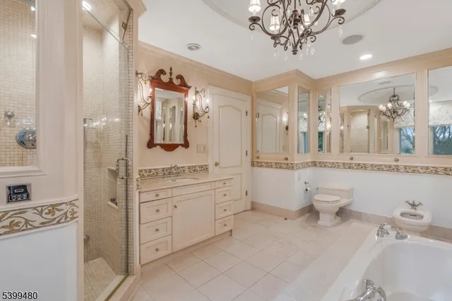 a bathroom with a double vanity sink mirror and shower
