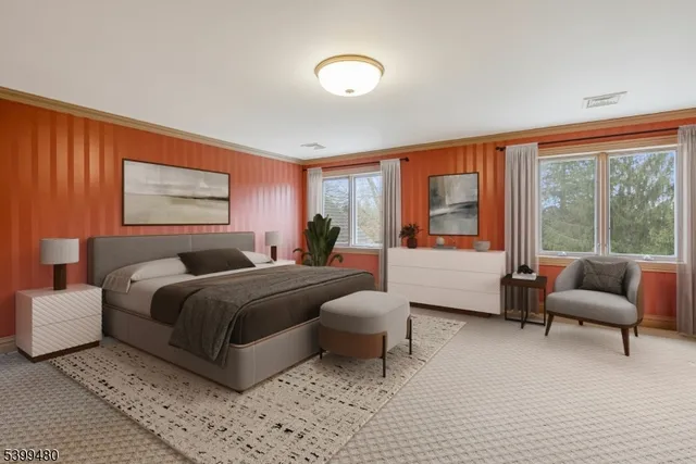 a bedroom with a bed and a couch