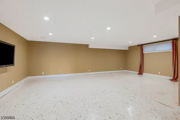 a view of an empty room with a flat screen tv