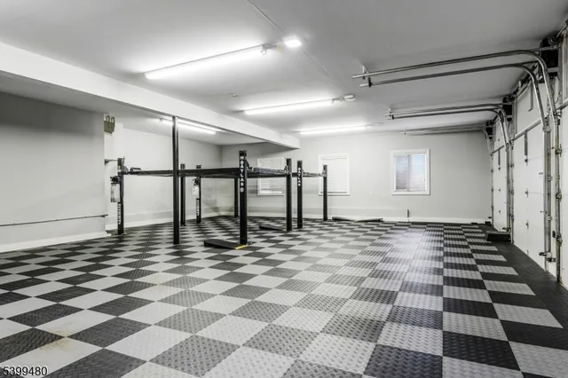 a view of a room with a black and white checkered floor