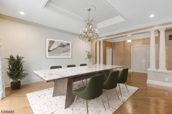 a dining room with a table and chairs